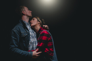 man and woman dark studio. Couple in love. Erotica. Kissing man and woman. 