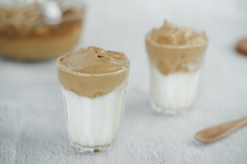 Iced Dalgona Coffee, a trendy fluffy creamy whipped coffee. Summer iced coffee.with copyspace for your text.