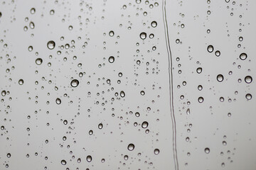 Fototapeta na wymiar Water (rain) droplets on the glass