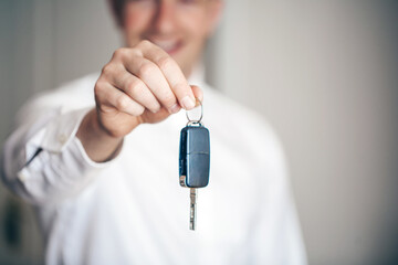 man holding car key