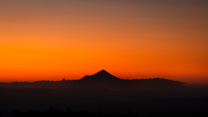 Panoramic view of silhouette Mt Taranaki at sunset. Viewed from Tongariro National park