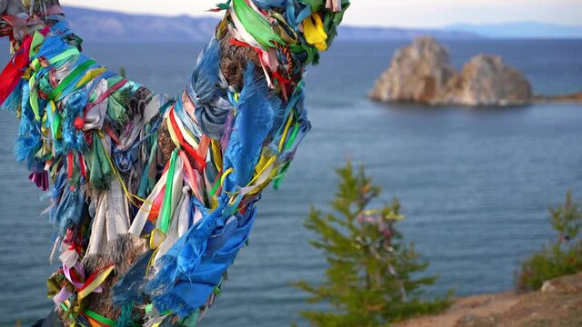 Ritual ribbons on a tree on the Olkhon island in Lale Baikal, Russia