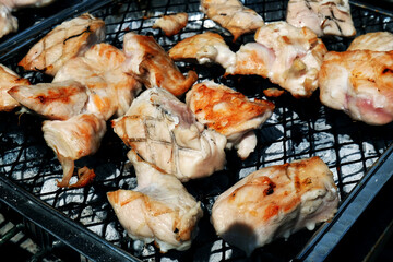 Barbecue cooking in an urban house garden in summer weather. UK.