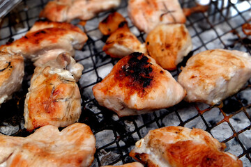Barbecue cooking in an urban house garden in summer weather. UK.