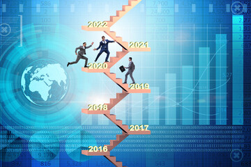 Businessman climbing stairs on yearly basis