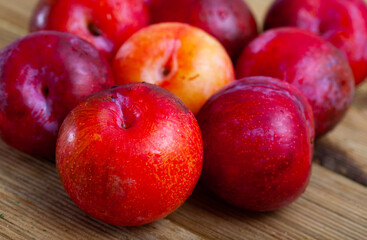 Fototapeta na wymiar Image of fresh ripe red plums, harvest from garden