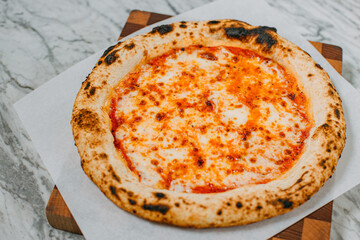 hot italian pizza on marble table