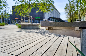 Fototapeta na wymiar Wooden bench in the city park