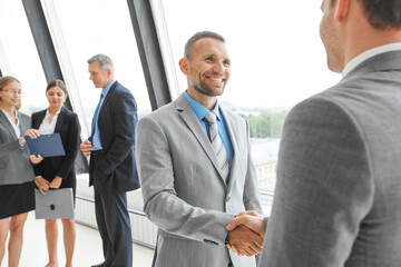 Fototapeta premium Business people handshake in office