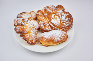 sweet bun on a plate with a white background