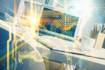 Double exposure of desktop with computer and world map hologram. International data network concept.