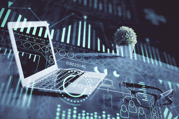 Computer on desktop in office with technology theme hologram. Multi exposure. Tech concept.