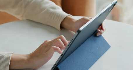 Woman uses tablet computer