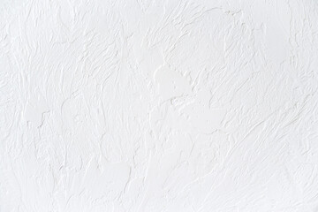 The texture of the white concrete table. White painted texture with brush and palette knife strokes...