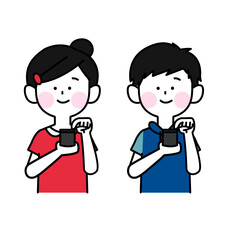 嬉しそうにスマホをいじる男女の子ども