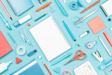Assorted office and school white orange and blue stationery supply on pastel trendy background as...