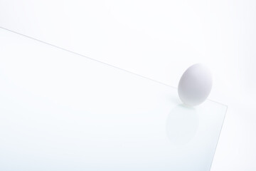 fresh white chicken eggs on glass isolated on white background