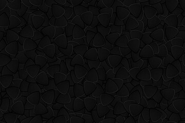 Dark seamless background on a musical theme from guitar picks of black color