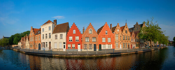 Typical Belgian cityscape Europe tourism concept - panorama of canal and old houses on sunset. Bruges (Brugge), Belgium