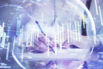 International business hologram over hands taking notes background. Concept of success. Multi exposure