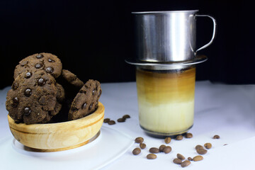 Chocolate granules cookies served with strong Vietnamese drip coffee, bitter coffee and sweet cookies are best served when relaxing such as reading a book or when we need energy