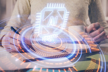Double exposure of writing hands on background with data solution hologram on front. Technology concept. Side view.
