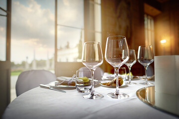 Large festive wine glasses in a restaurant on a table