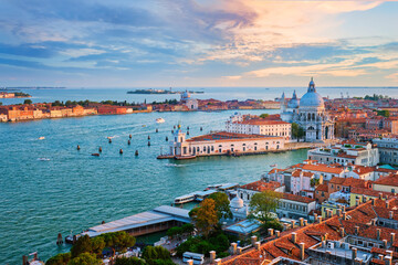 Naklejka na ściany i meble Aerial view of Venice lagoon and Santa Maria della Salute church on sunset. Venice, Italy