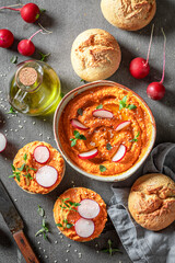 Tasty roll with hummus, radish and herbs