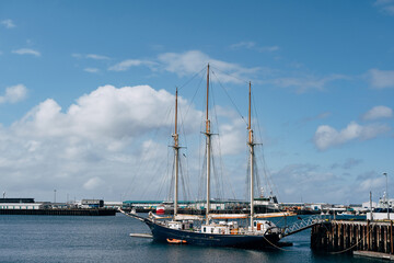 Sailing wooden ship with three masts moored in the port of Reykjavik, in the capital of Iceland.