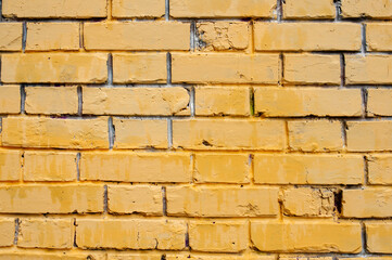 Texture background. The old yellow brick wall.
