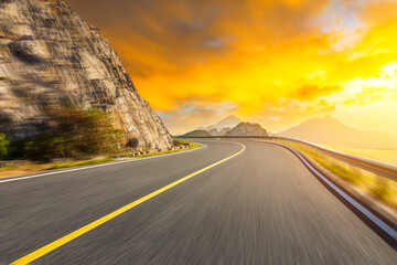 Motion blurred road and mountains at sunrise.mountain road background.