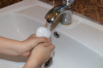 Hand washing with soap.