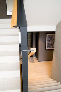 Modern Staircase With Stairs And Wooden Balustrade