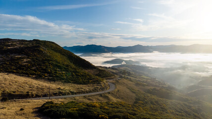 Aerial shot - Scenic view of Road at the peak at Bank Peninsula, Akaroa, New Zealand.