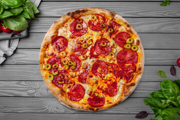 Tasty hot italian pizza with pepperoni and olives. Pizzeria menu. Concept poster for Restaurants or pizzerias. Top view