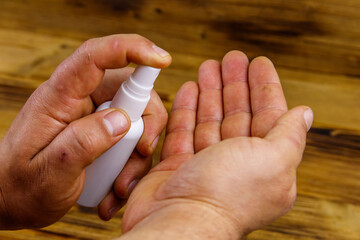 Man hands using hand sanitizer. Concept of coronavirus prevention