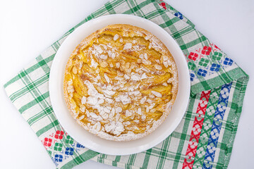delicious apple tart on white plate on white background
