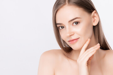 Beautiful Young Woman touching her clean face with fresh Healthy Skin, isolated on white background, Beauty Cosmetics and Facial treatment Concept