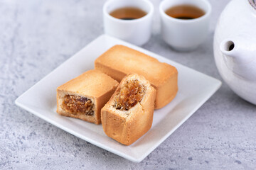 Pineapple cake pastry - Taiwanese famous sweet delicious dessert food with tea, close up, copy space design.