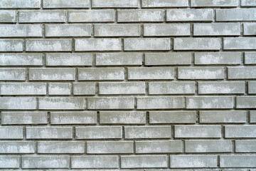 Gray brick wall. Exterior of an old building. Vintage interior texture.