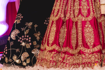 Black and red are two beautiful Indian wedding lehengas