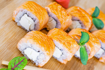 roll with baked salmon and greens, Japanese cuisine