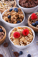 Bowls with different sorts of breakfast cereal products