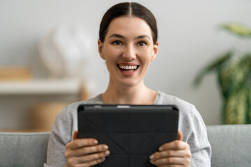 Fototapeta premium woman is using tablet pc