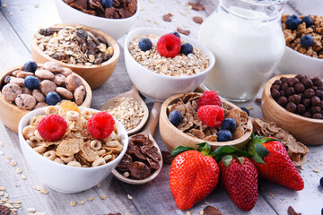 Bowls with different sorts of breakfast cereal products