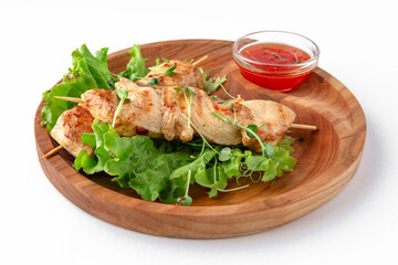 Chicken meat kebab with sauce. Banquet festive dishes. Gourmet restaurant menu. White background.