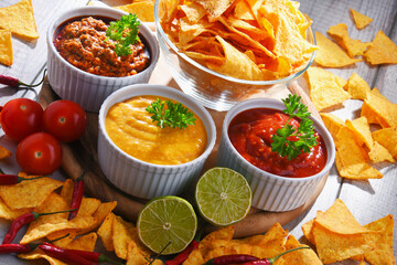 Composition with bowl of tortilla chips.