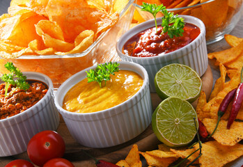Composition with bowl of tortilla chips.