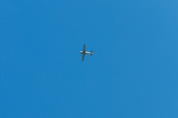Biplane flying in blue sky
